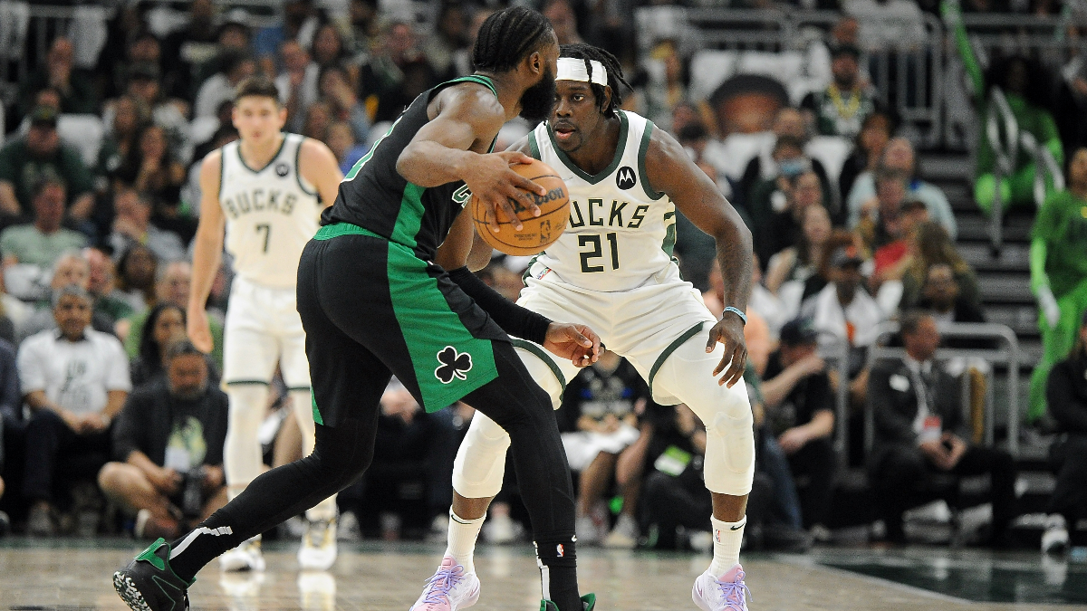 Boston Celtics guard Jaylen Brown and Milwaukee Bucks guard Jrue Holiday