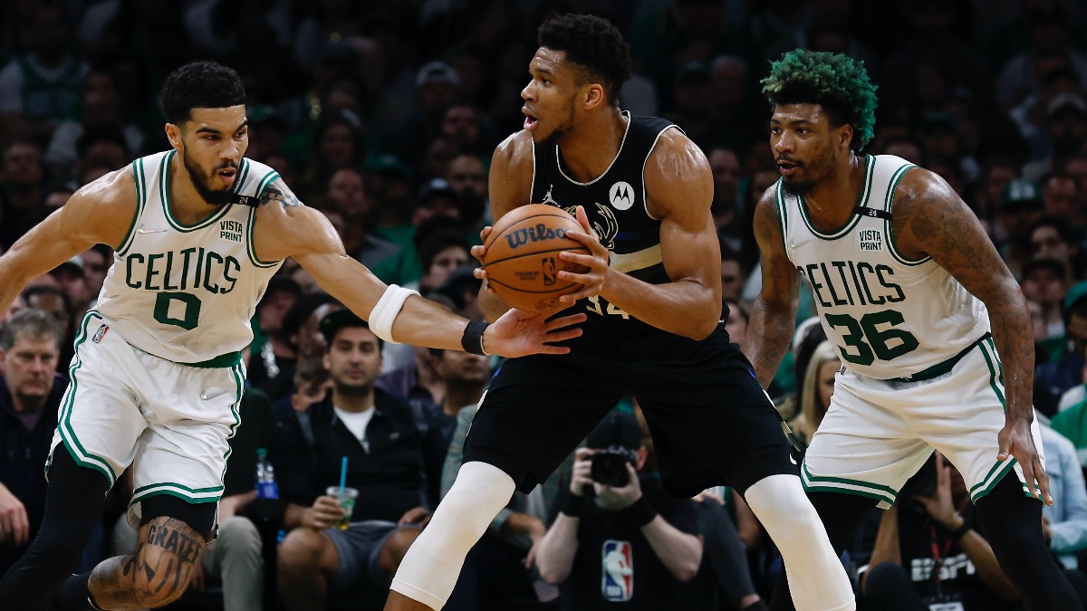 Boston Celtics forward Jayson Tatum, Marcus Smart, Milwaukee Bucks forward Giannis Antetokounmpo