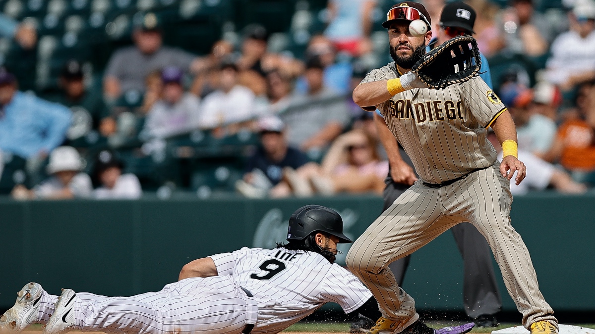 Eric Hosmer tries to tag Connor Joe on dive back to first.