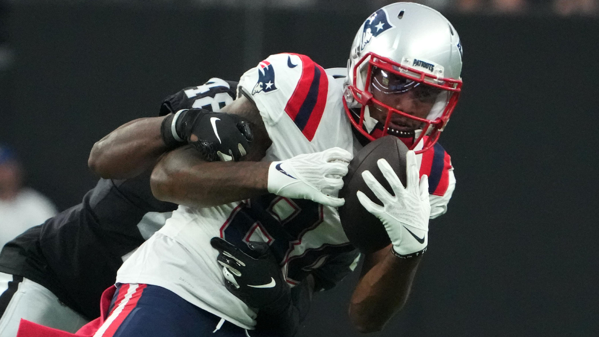 New England Patriots wide receiver Kendrick Bourne (84) is tackled by Las Vegas Raiders cornerback Sam Webb (48) in the first half at Allegiant Stadium. Mandatory Credit: Kirby Lee-USA TODAY Sports