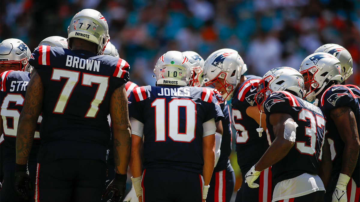 New England Patriots quarterback Mac Jones and team