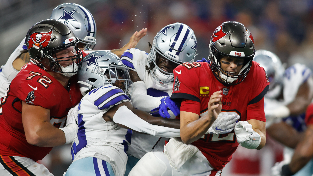 Dallas Cowboys defensive end Tarell Basham and Tampa Bay Buccaneers quarterback Tom Brady
