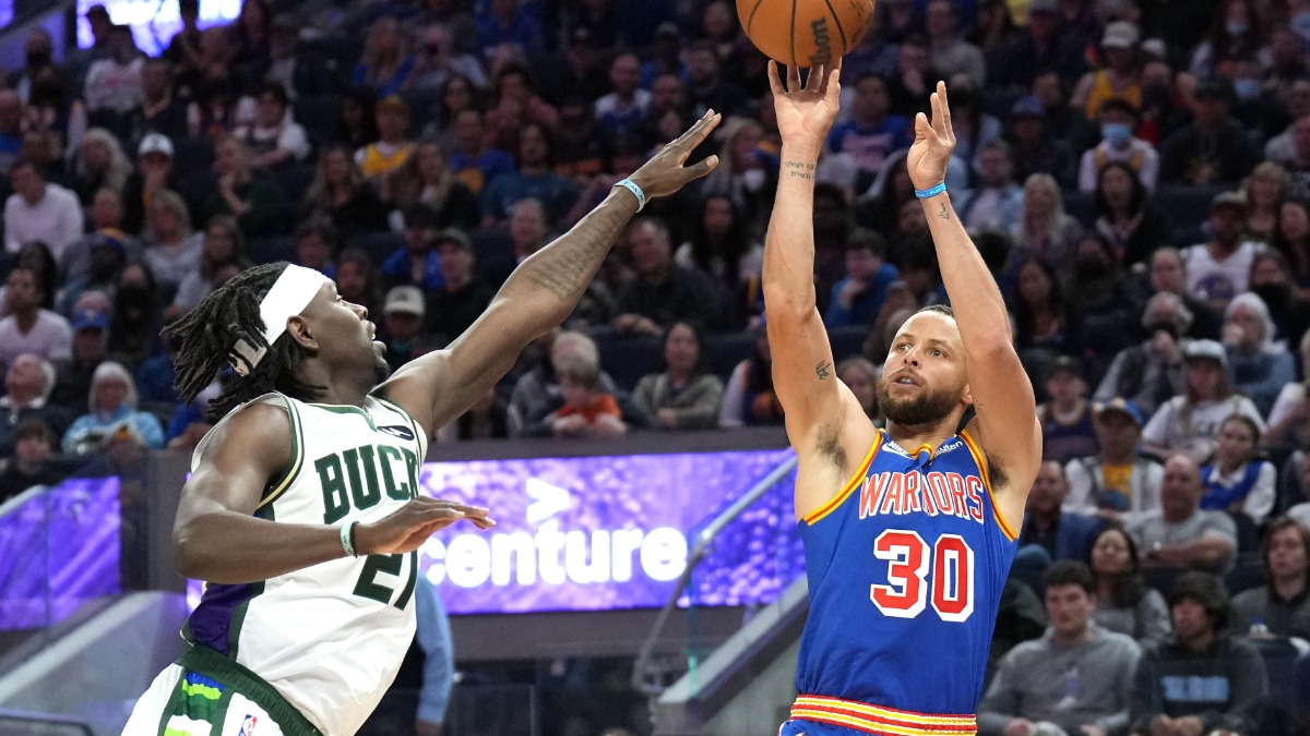 Milwaukee Bucks guard Jrue Holiday, Golden State Warriors guard Stephen Curry