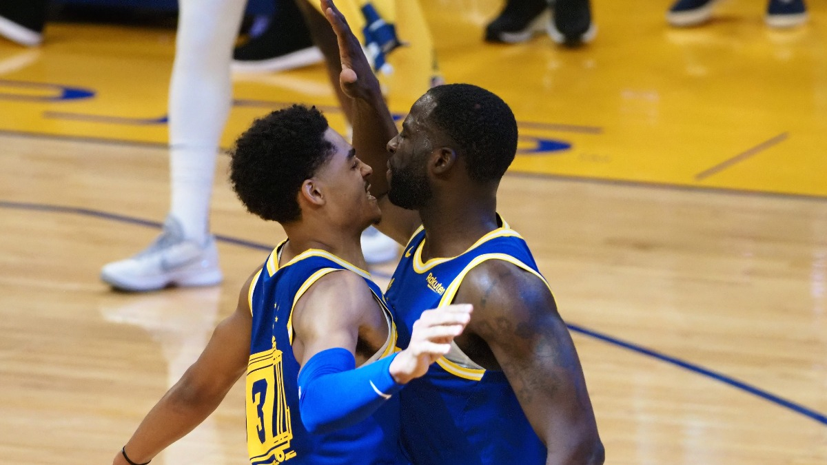 Jordan Poole and Draymond Green of the Golden State Warriors
