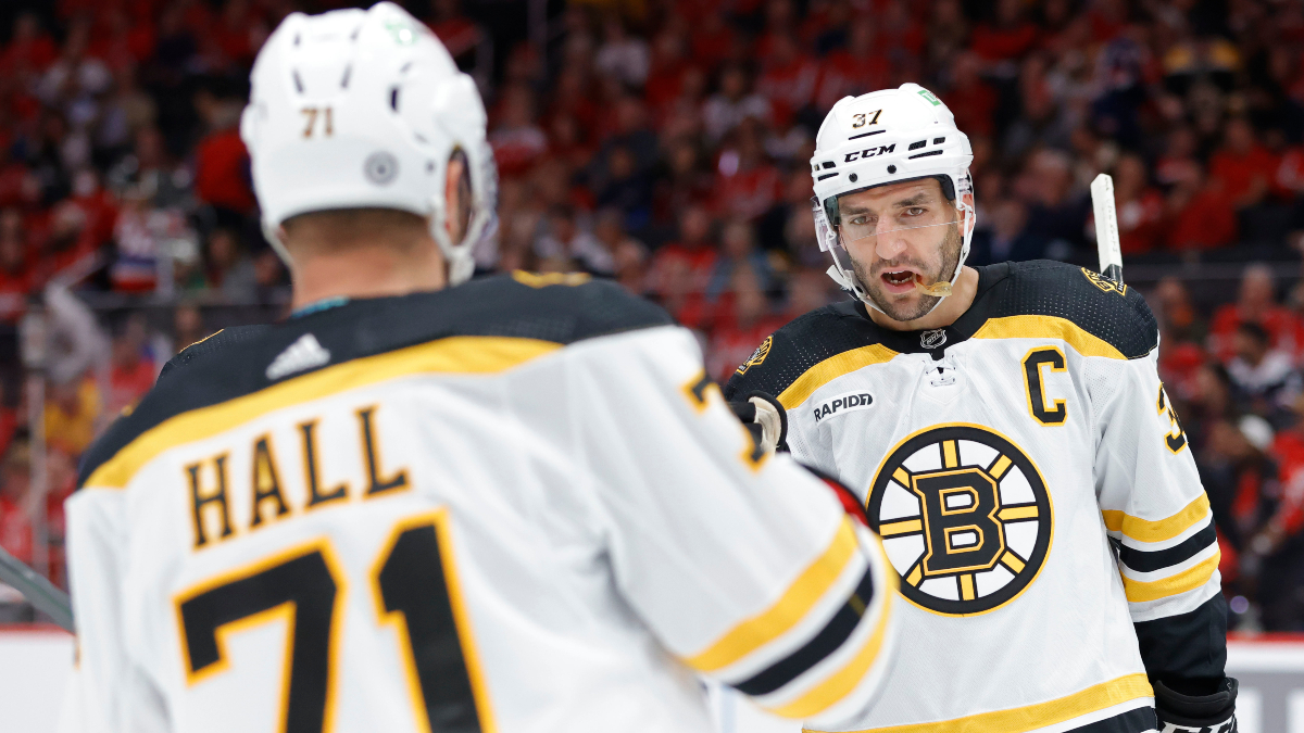 Boston Bruins forwards Patrice Bergeron and Taylor Hall