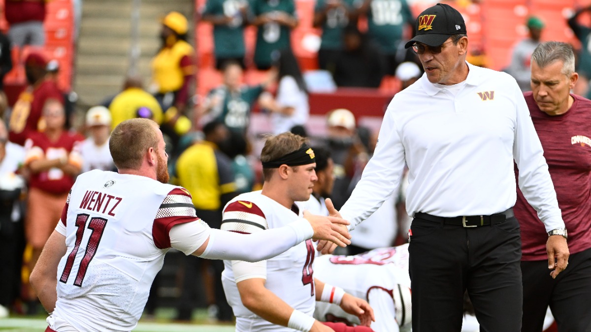 Washington Commanders head coach Ron Rivera, quarterback Carson Wentz