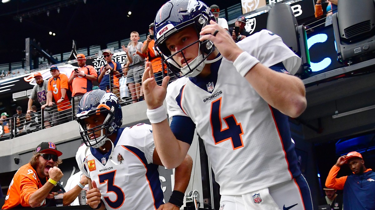 Denver Broncos quarterbacks Brett Rypien, Russell Wilson