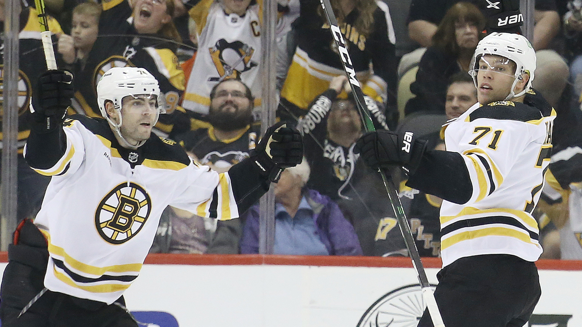 Boston Bruins forwards Jake DeBrusk and Taylor Hall