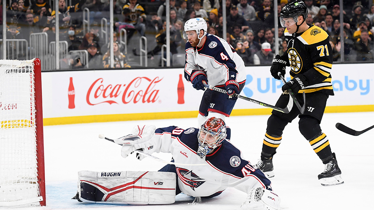 Boston Bruins forward Taylor hall and Columbus Blue Jackets goalie Danil Tarasov