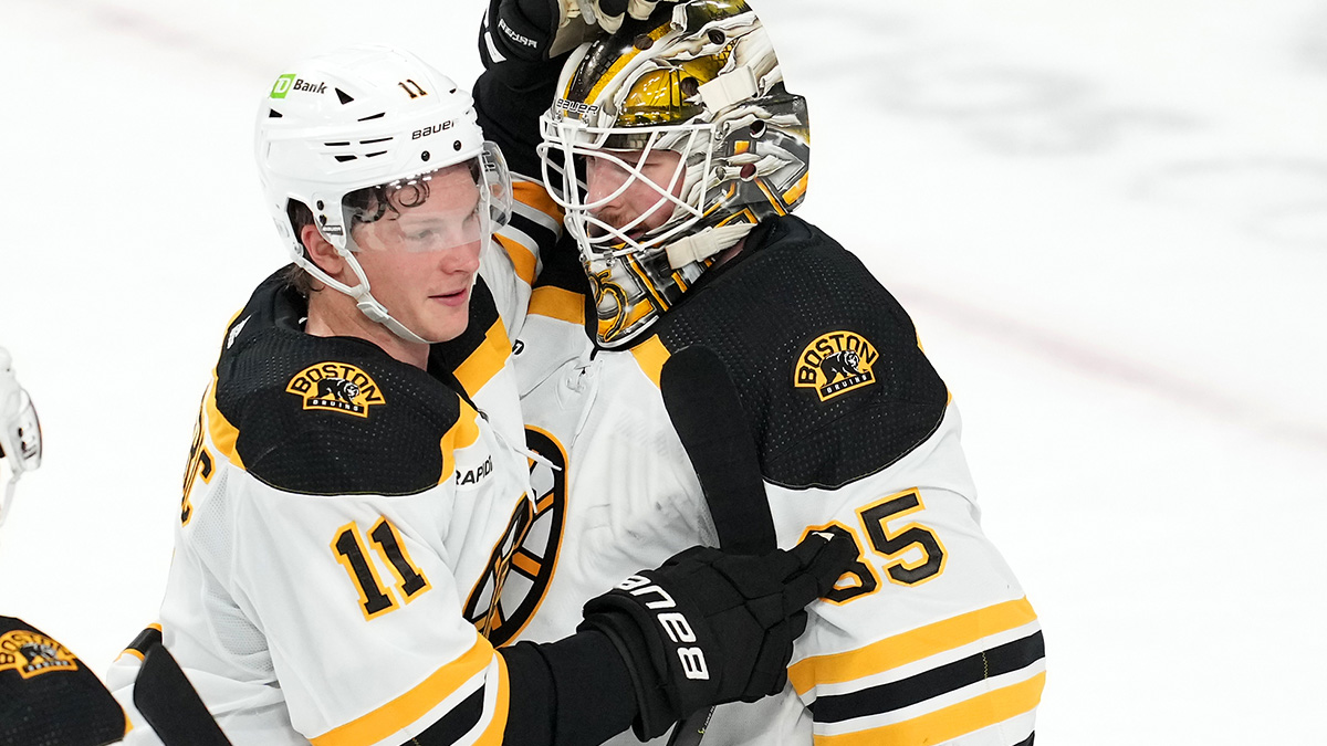Boston Bruins center Trent Frederic and goaltender Linus Ullmark
