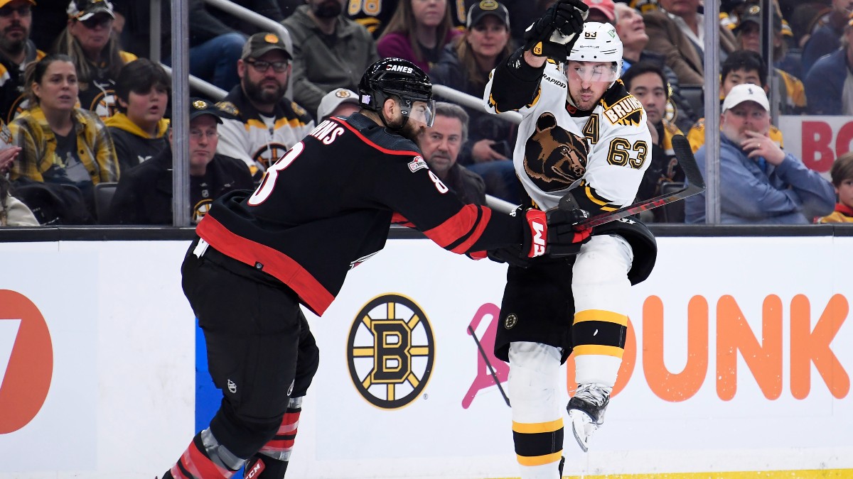 Carolina Hurricanes defenseman Brent Burns and Boston Bruins forward Brad Marchand