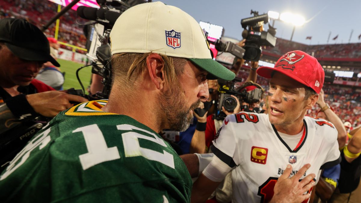 Green Bay Packers quarterback Aaron Rodgers and former NFL quarterback Tom Brady