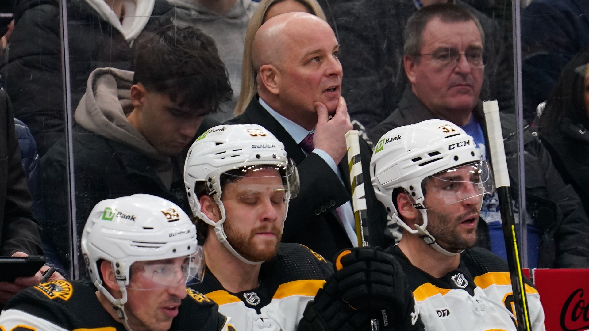 Boston Bruins head coach Jim Montgomery, forwards Brad Marchand, David Pastrnak, Patrice Bergeron