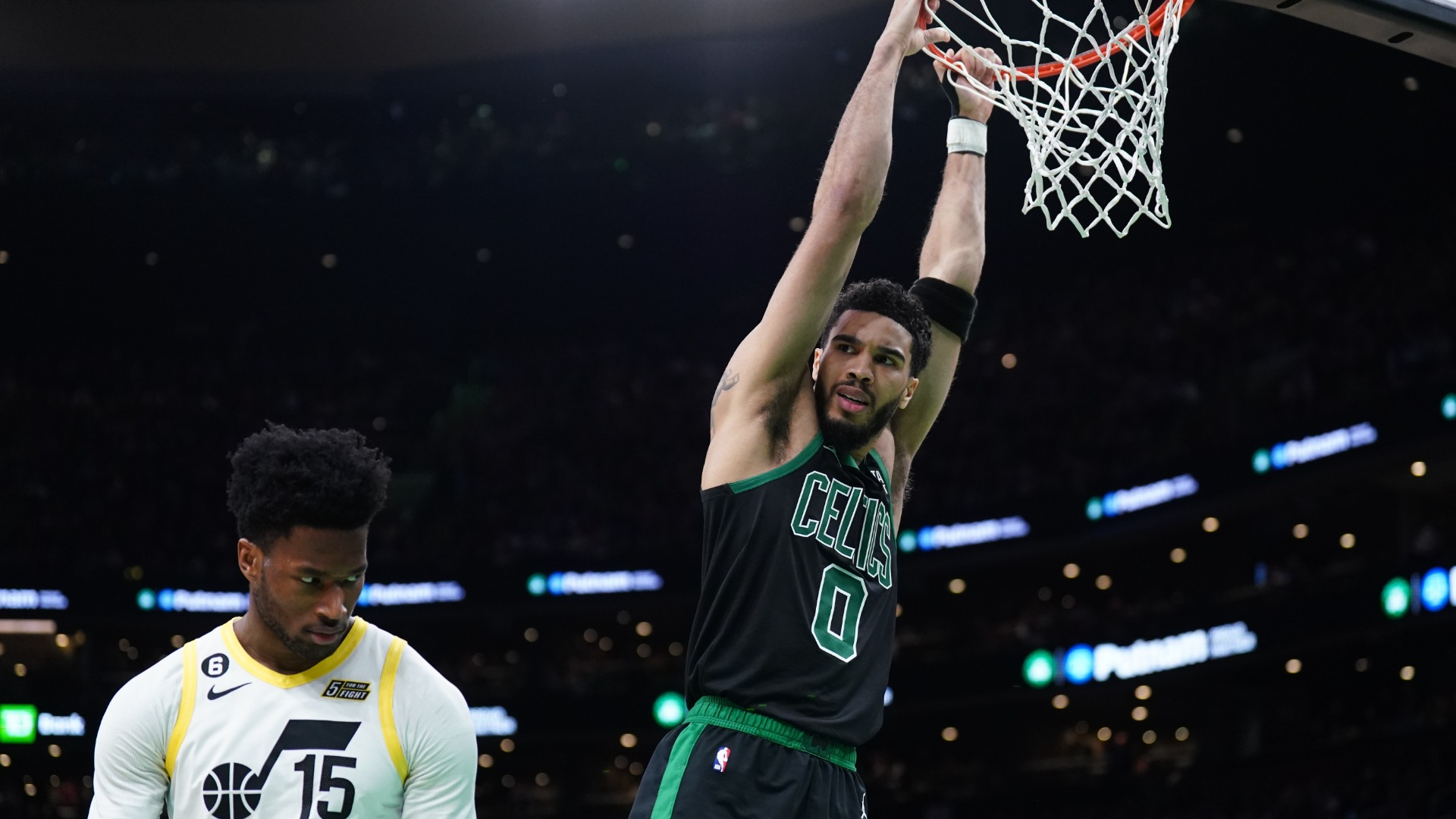 Boston Celtics forward Jayson Tatum and Utah Jazz center Damian Jones
