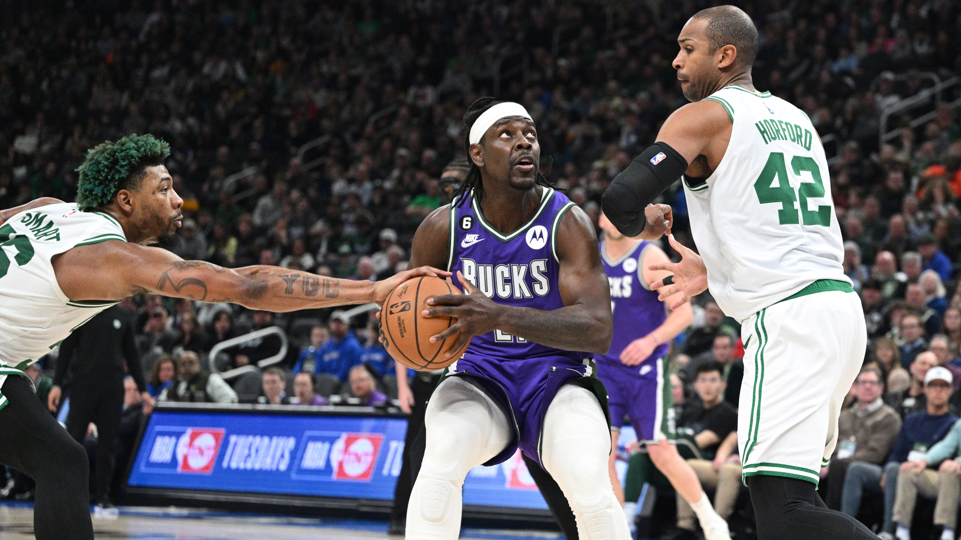 Milwaukee Bucks guard Jrue Holiday and Boston Celtics guard Marcus Smart and forward Al Horford