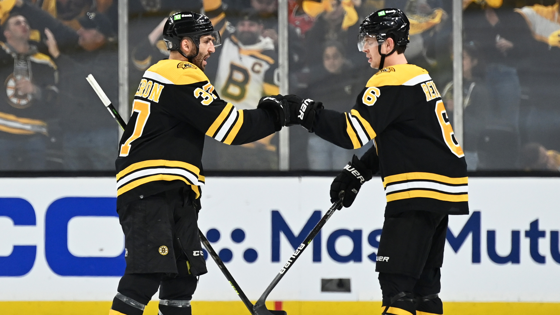 Boston Bruins forward Patrice Bergeron and defenseman Mike Reilly
