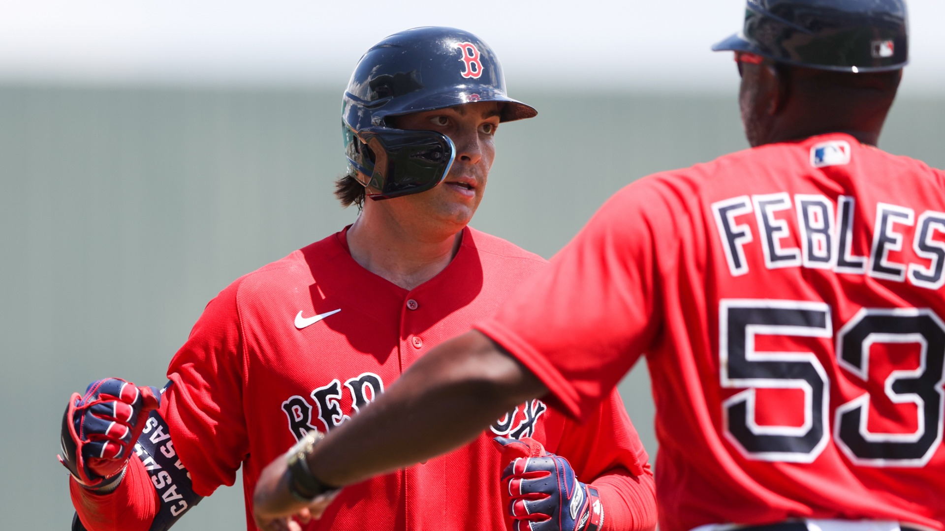 Boston Red Sox infielder Triston Casas, third base coach Carlos Febles