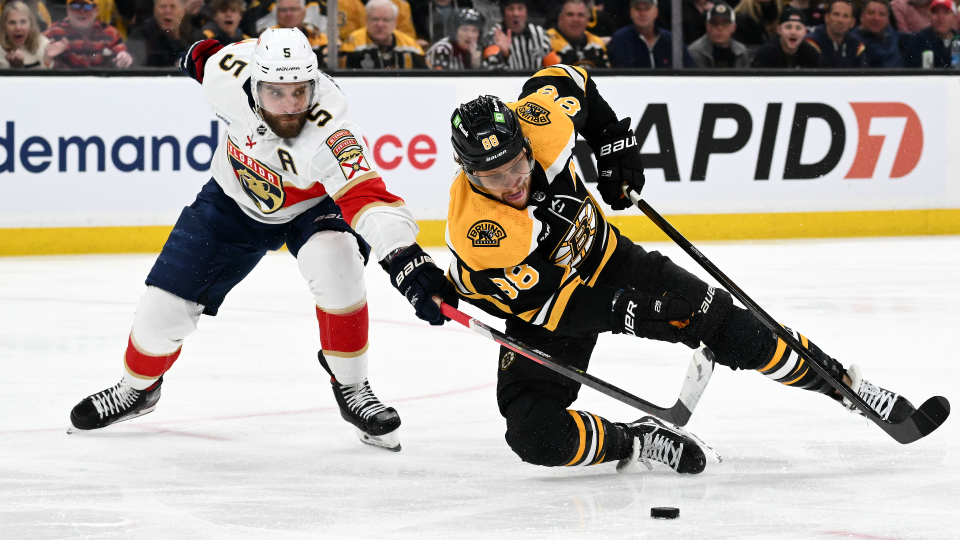 Florida Panthers defenseman Aaron Ekbad and Boston Bruins right wing David Pastrnak