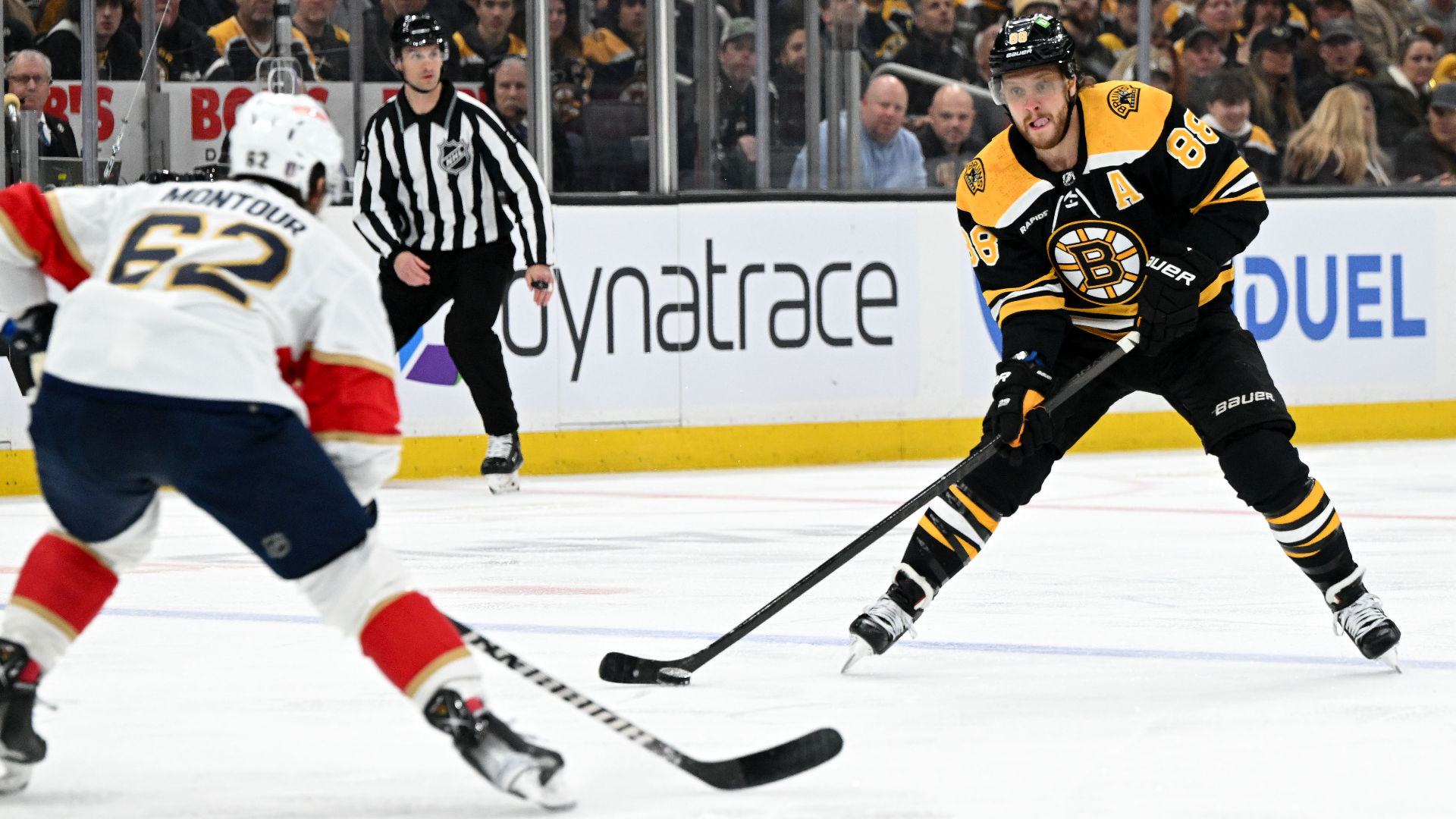 Florida Panthers defenseman Brandon Montour and Boston Bruins right win David Pastrnak