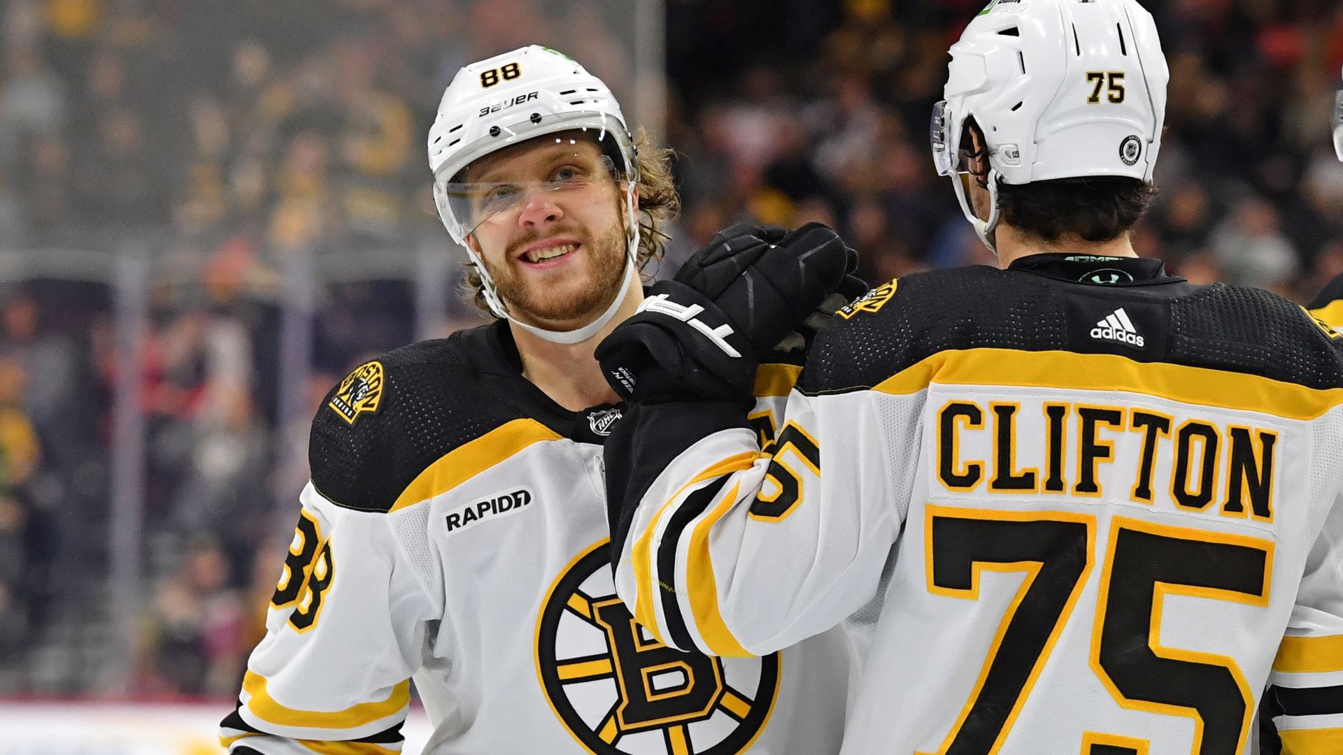 Boston Bruins right wing David Pastrnak and defenseman Connor Clifton