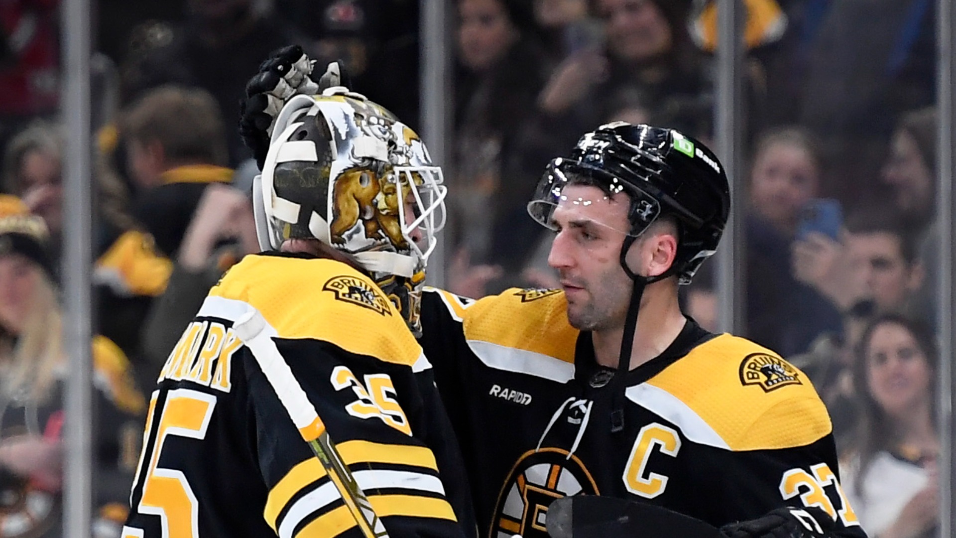 Boston Bruins goalie Linus Ullmark and center Patrice Bergeron