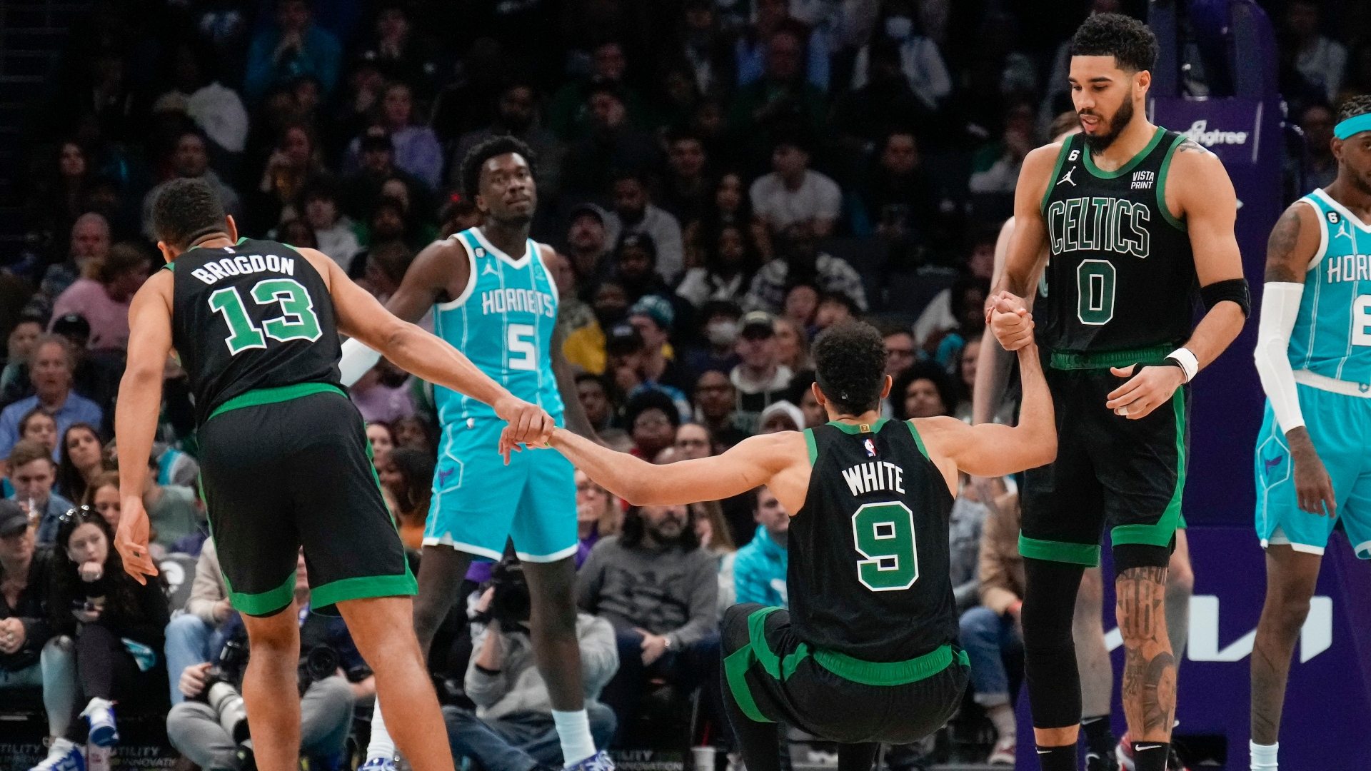 Boston Celtics guards Malcolm Brogdon and Derrick White and forward Jayson Tatum