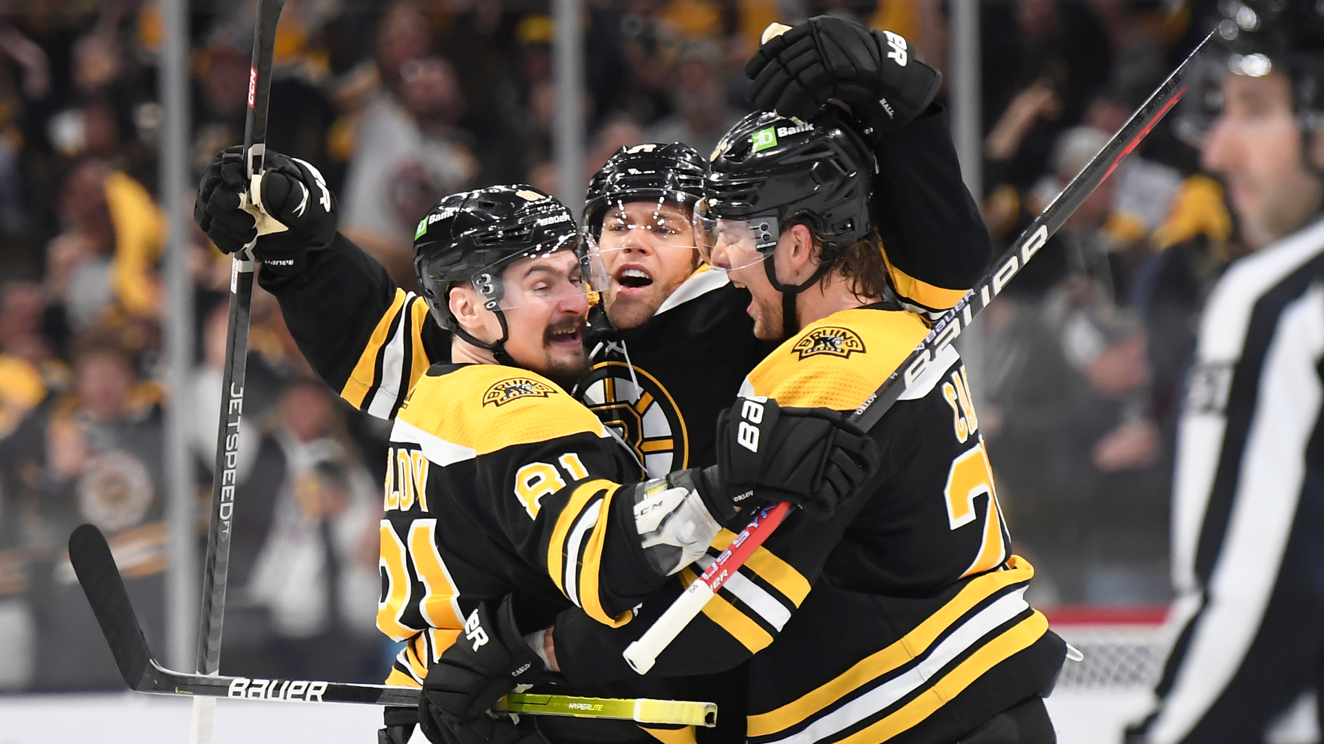 Boston Bruins forward Taylor Hall and defensemen Dmitry Orlov and Brandon Carlo