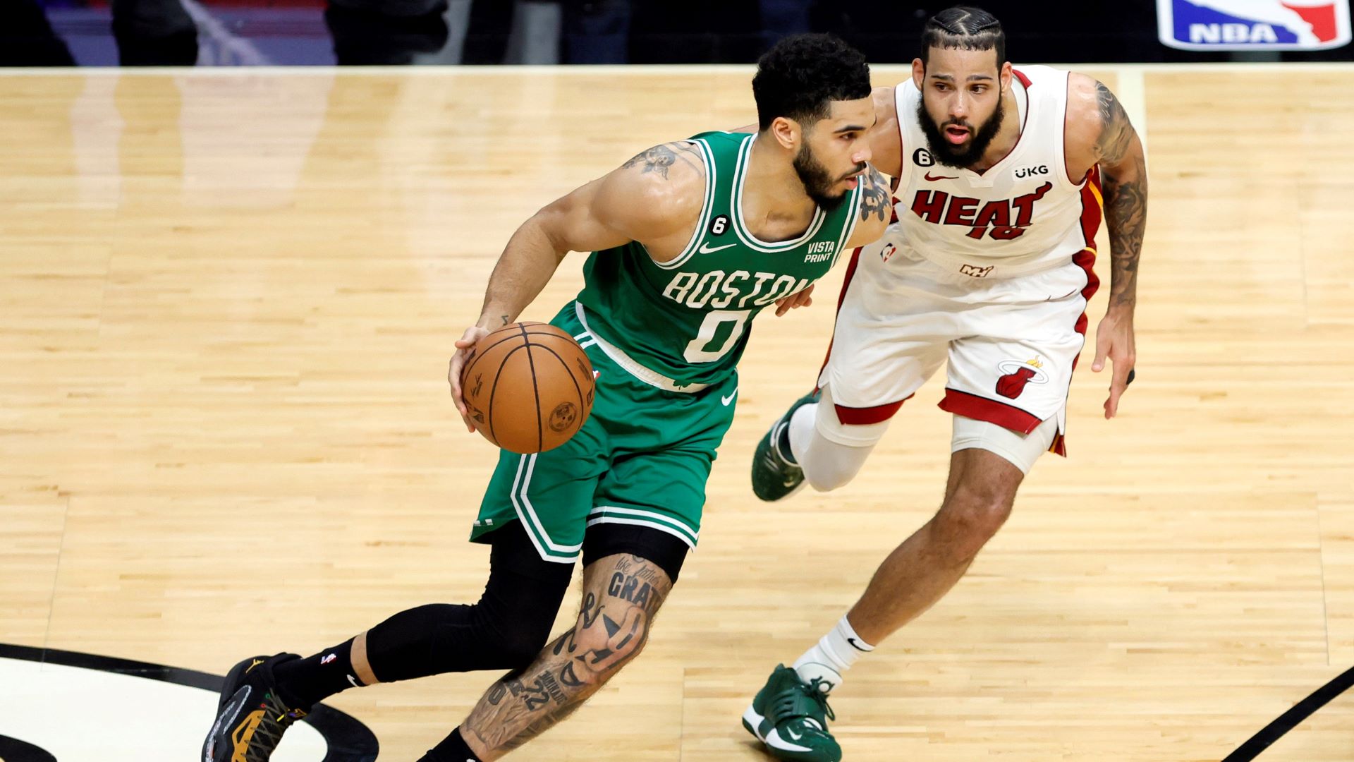 Boston Celtics forward Jayson Tatum and Miami Heat forward Caleb Martin