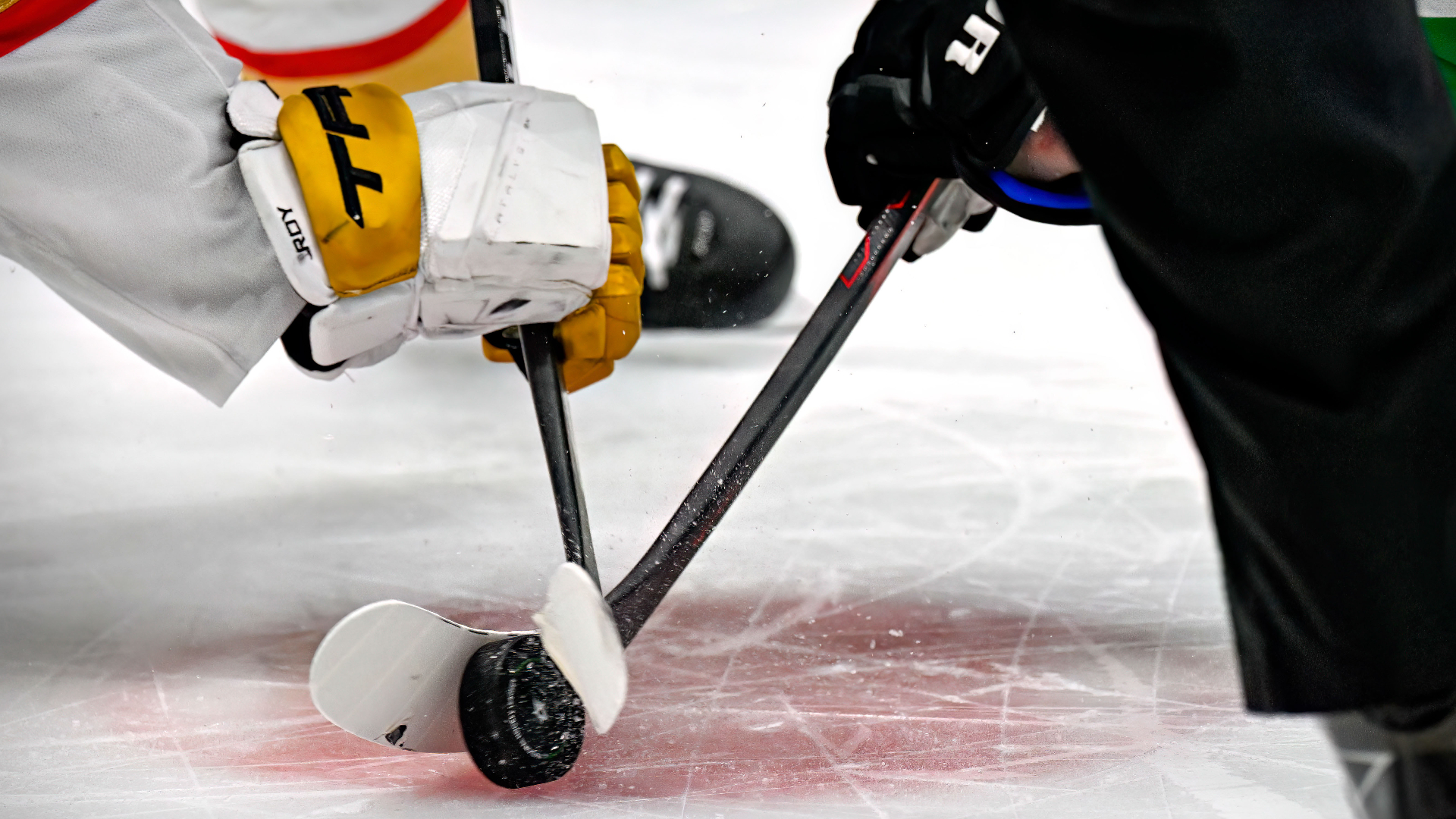 Hockey sticks and puck