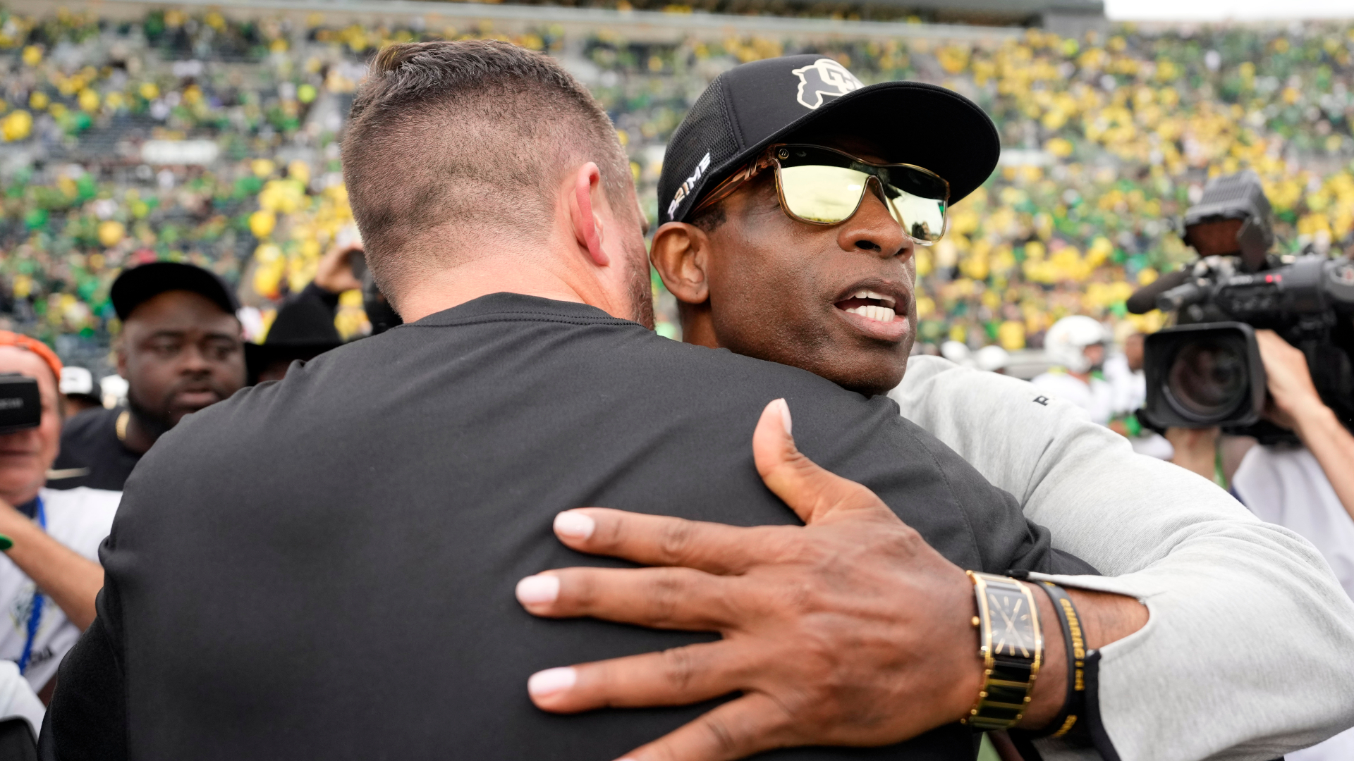 Colorado Buffaloes head coach Deion Sanders and Oregon Ducks head coach Dan Lanning