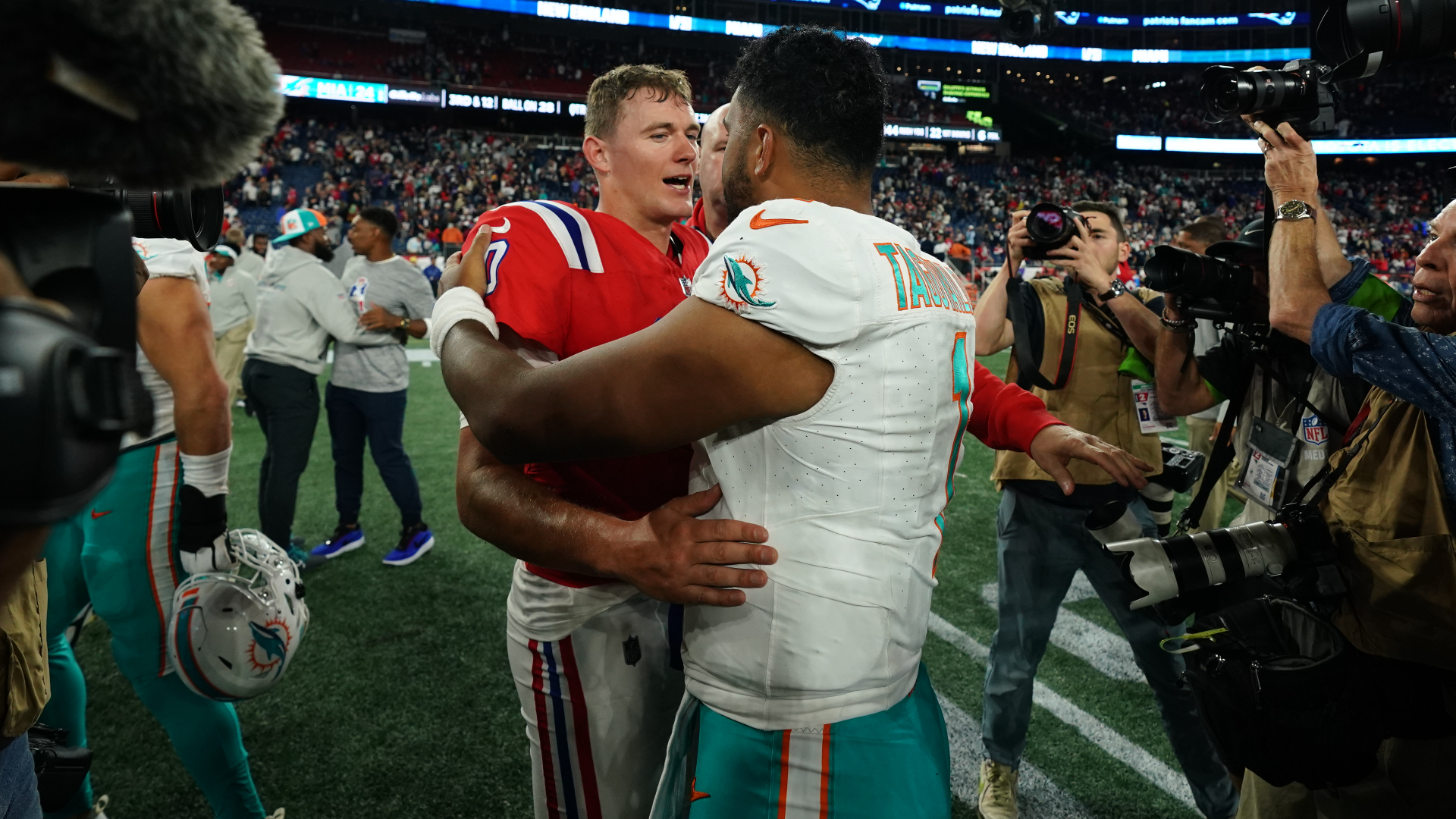 New England Patriots quarterback Mac Jones and Miami Dolphins quarterback Tua Tagovailoa