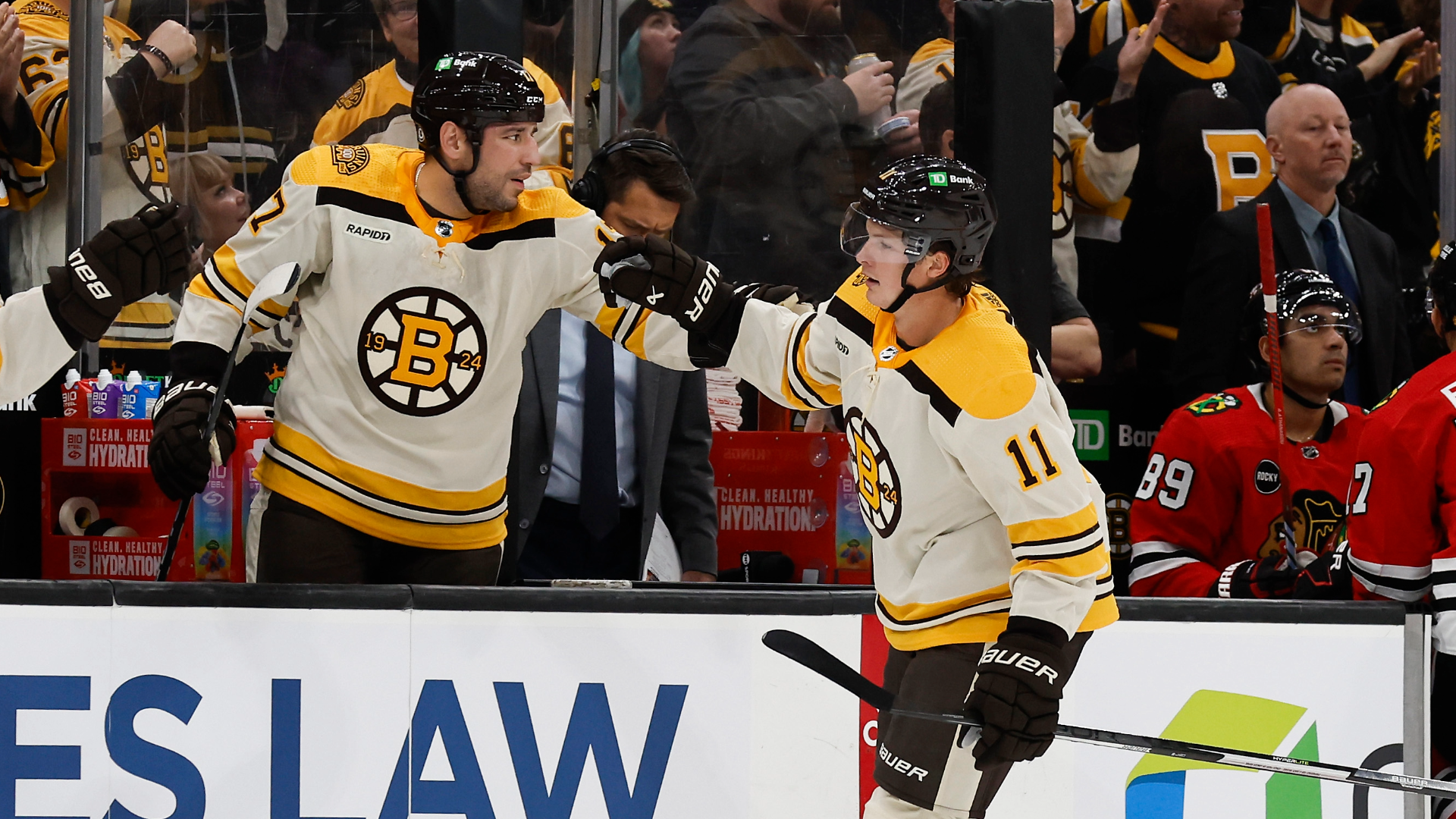Boston Bruins forwards Trent Frederic, Milan Lucic