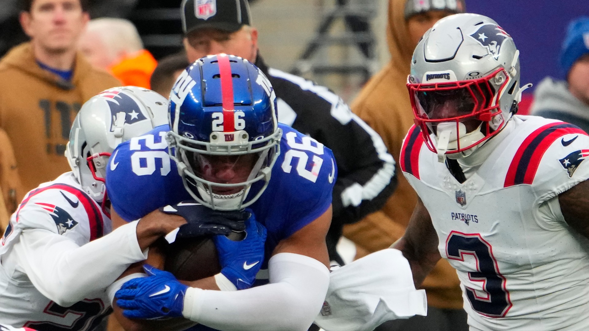New York Giants running back Saquon Barkley and New England Patriots line backer Mack Wilson Sr.