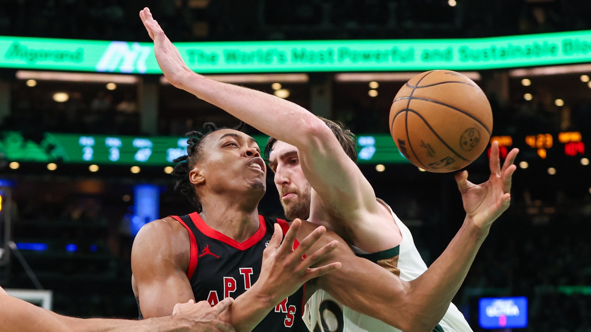 Boston Celtics center Luke Kornet and Toronto Raptors forward Scottie Barnes