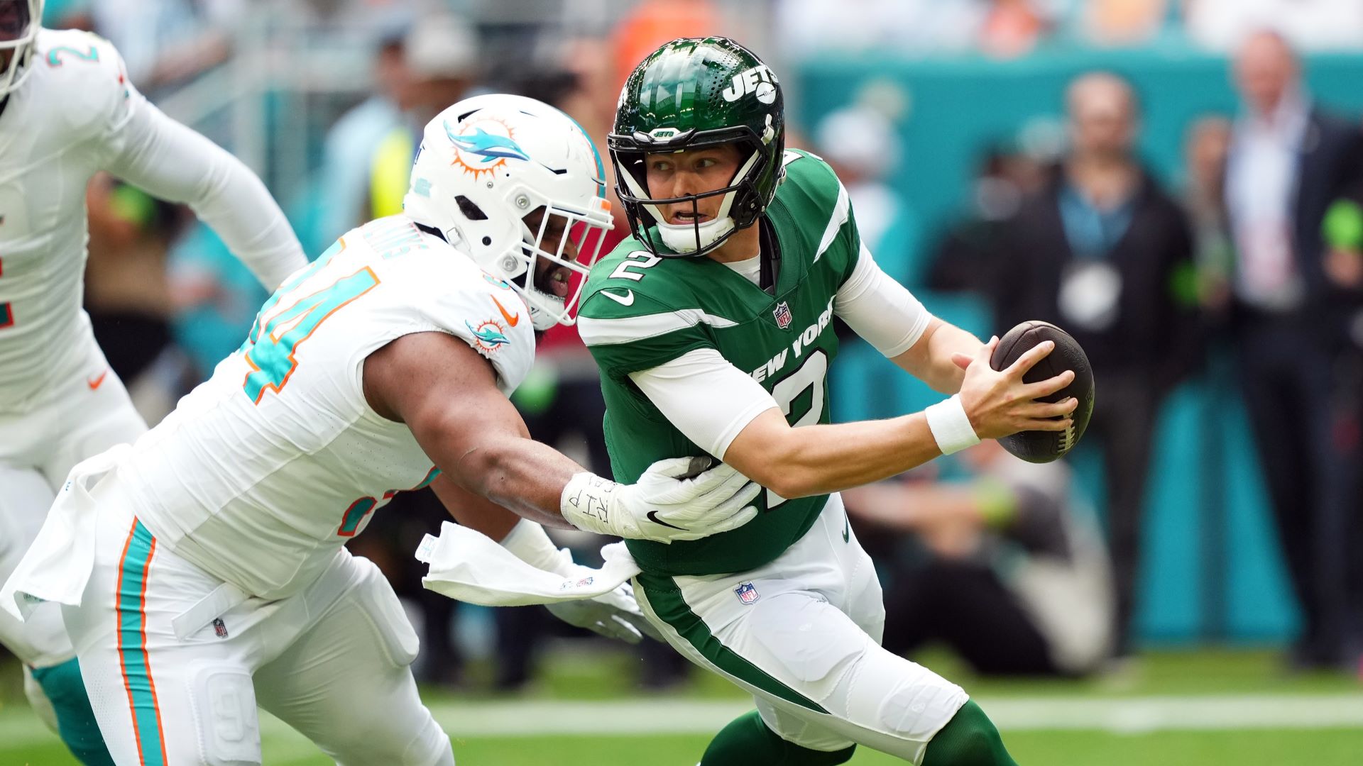 New York Jets quarterback Zach Wilson and Miami Dolphins defensive lineman Christian Wilkins