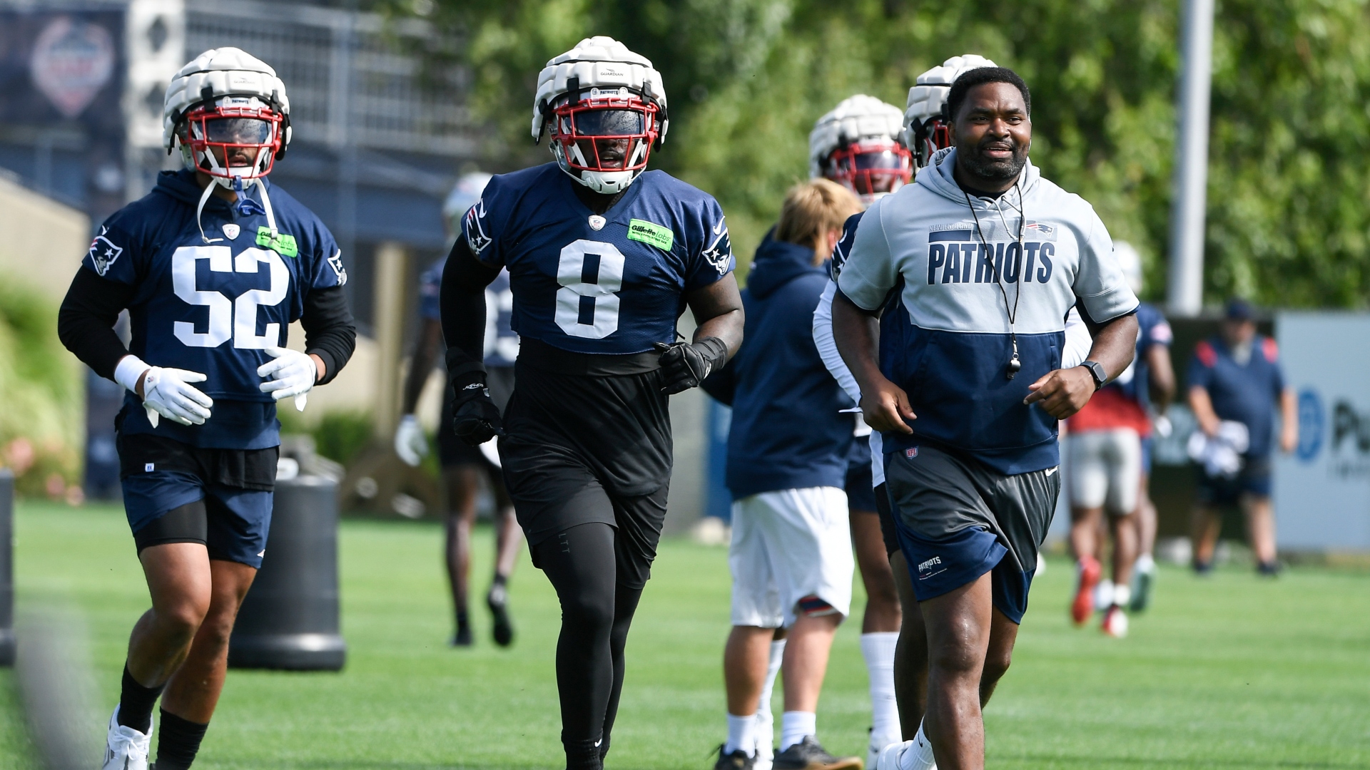 New England Patriots linebacker Ja'Whaun Bentley and head coach Jerod Mayo