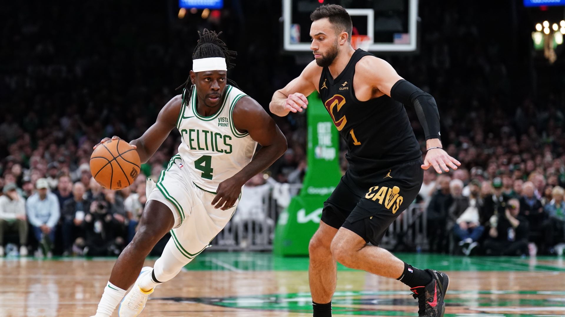 Boston Celtics guard Jrue Holiday and Cleveland Cavaliers guard Max Strus
