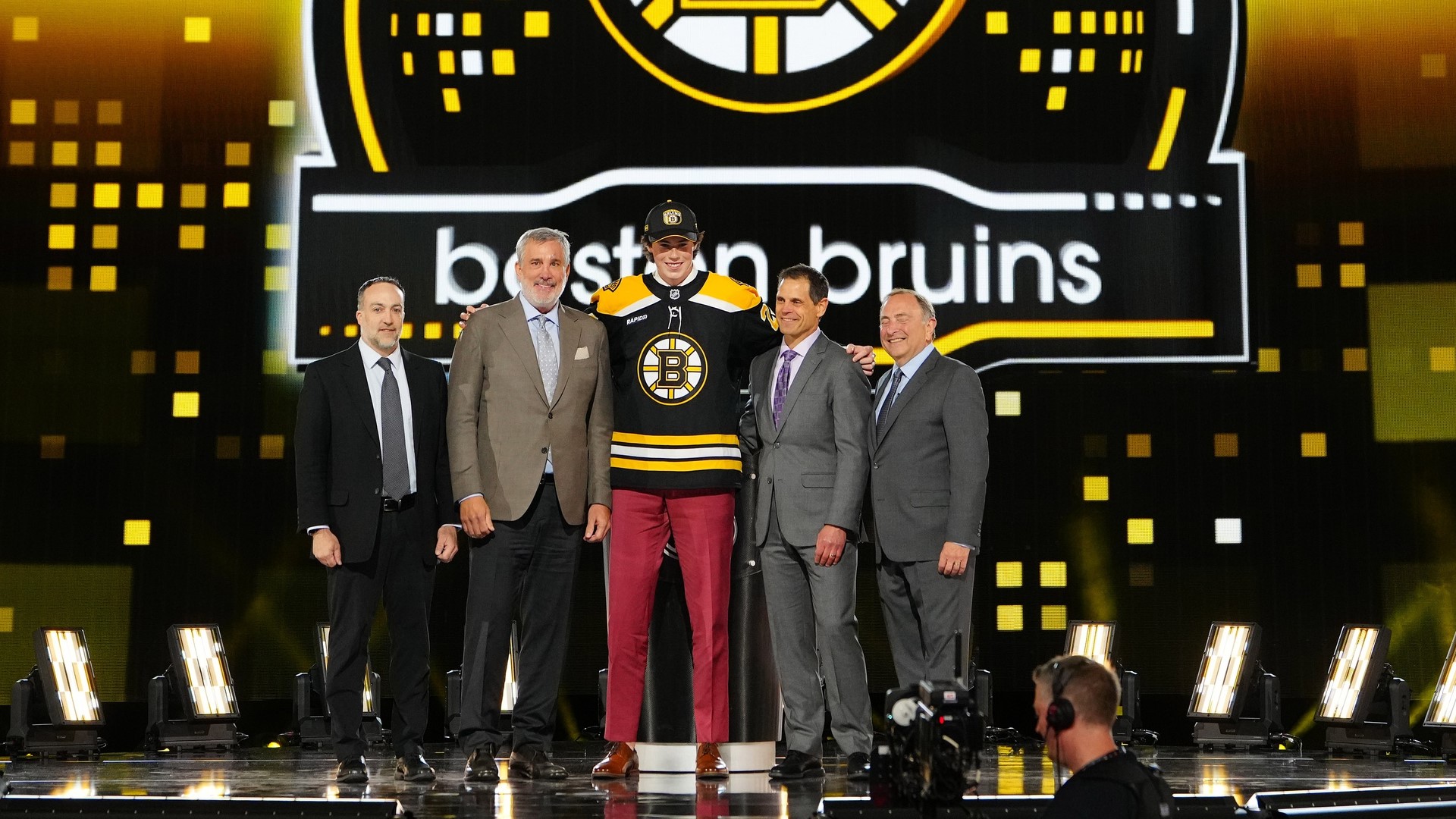 Boston Bruins president Cam Neely, general manager Don Sweeney, forward Dean Letourneau