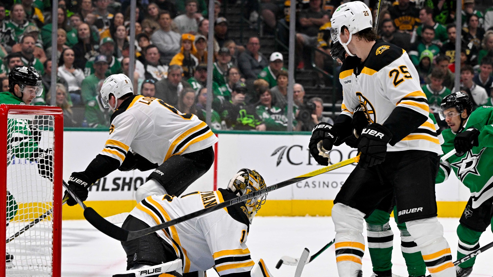 Boston Bruins defenseman Brandon Carlo and goalie Jeremy Swayman