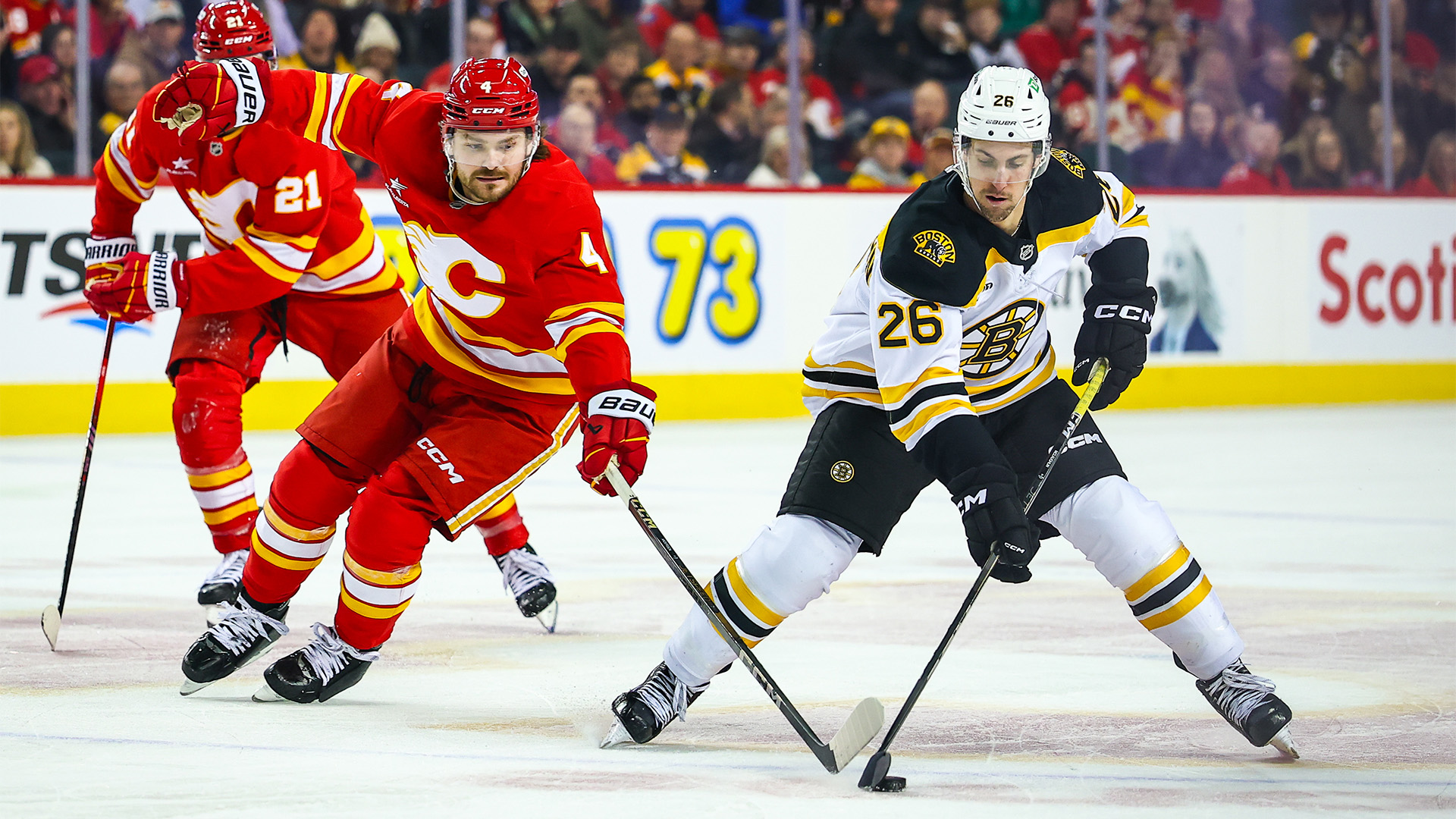 Boston Bruins forward Marc McLaughlin and Calgary Flames defenseman Rasmus Andersson