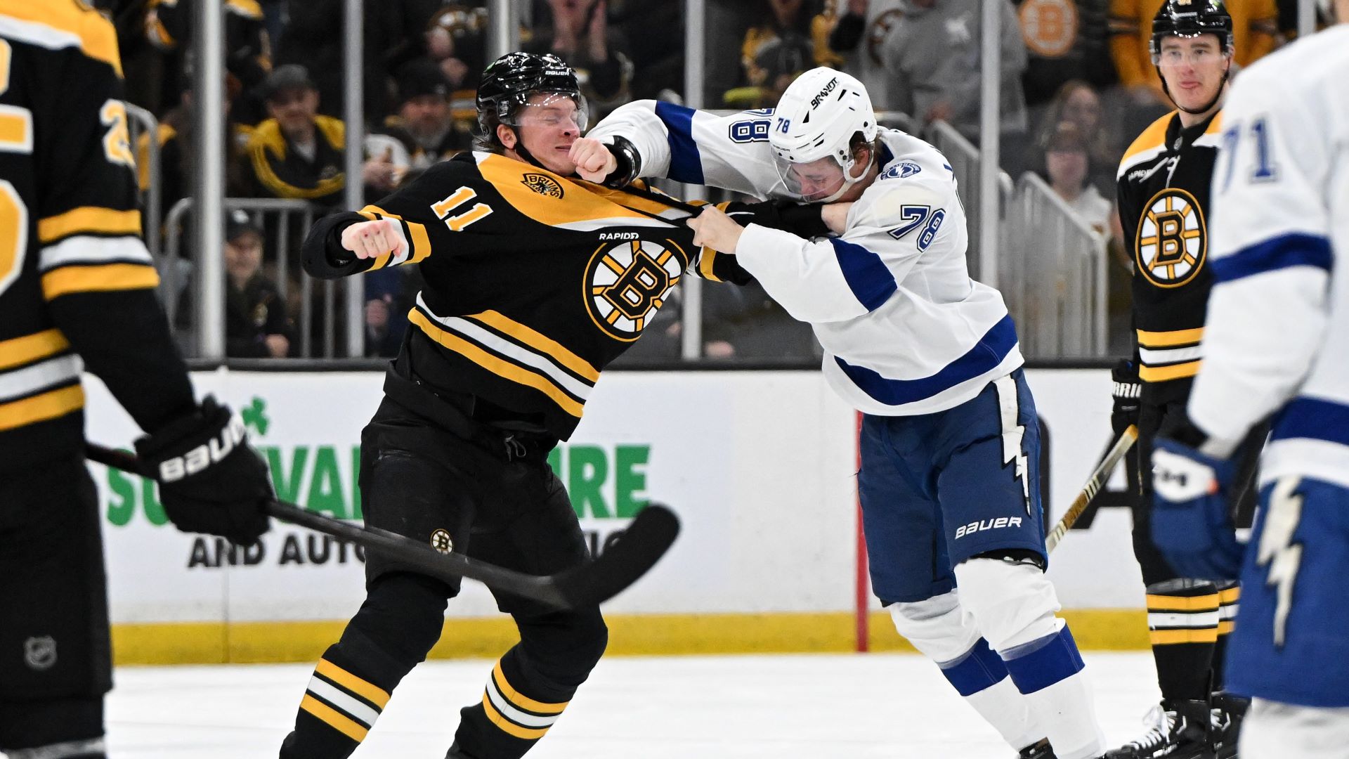 Boston Bruins forward Trent Frederic and Tampa Bay Lightning defenseman Emil Lileberg