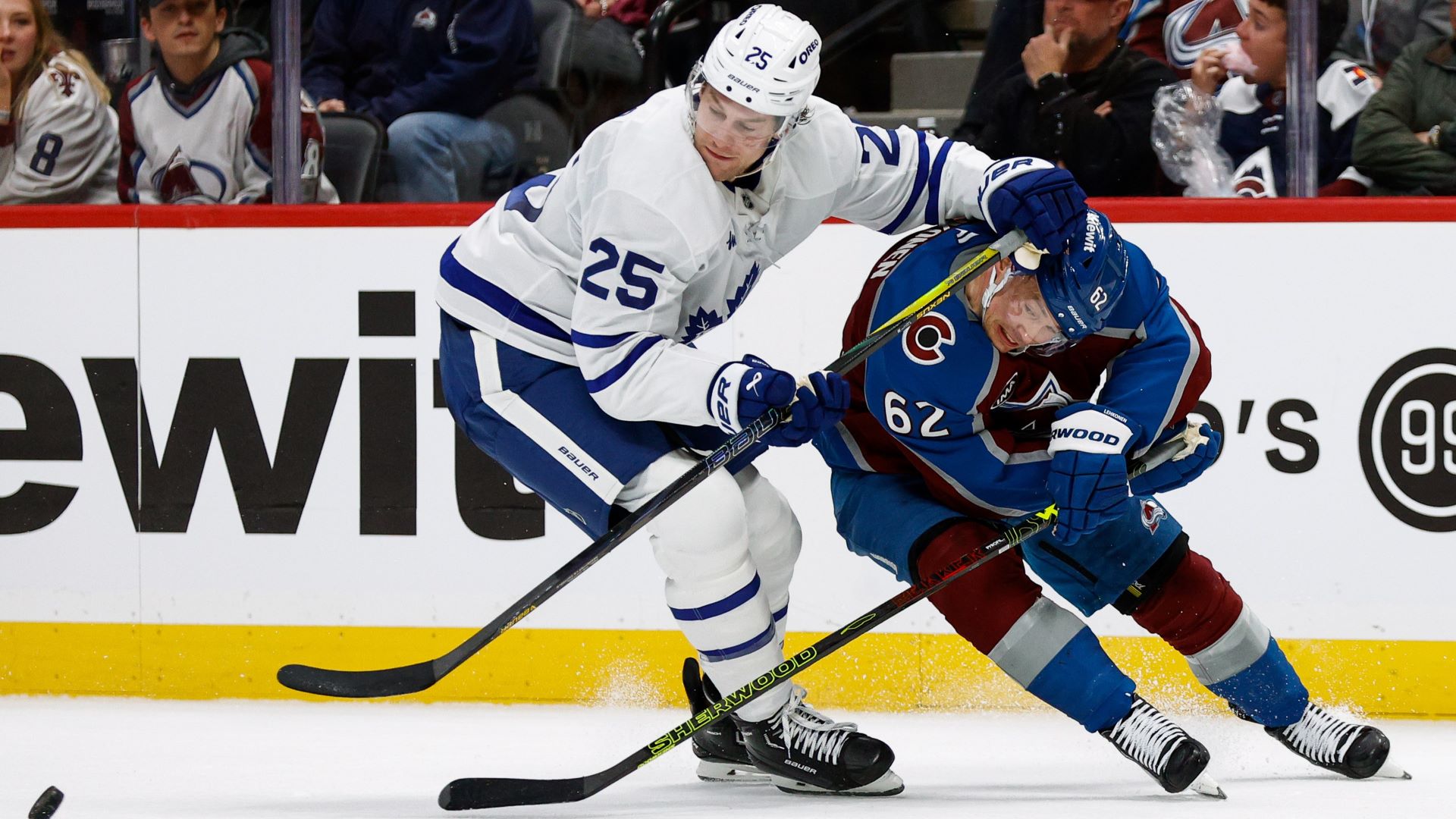 Toronto Maple Leafs defenseman Brandon Carlo and Colorado Avalanche forward Atturi Lehkonen